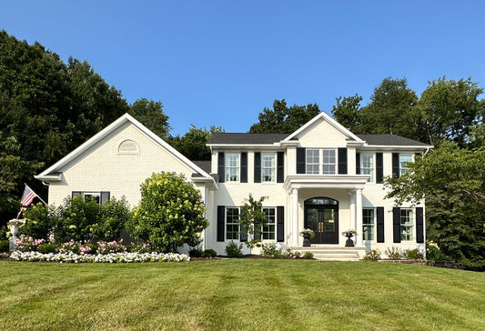 White painted brick colonial home